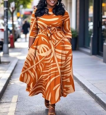 Plus size women's orange palm leaf print plus size midi dress round neck three-quarter sleeves